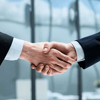 Partners shaking hands to mark an agreement